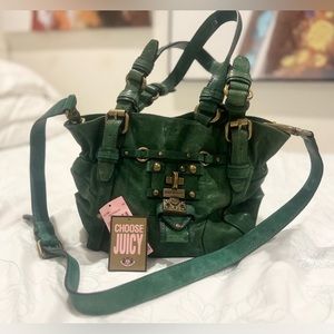 Juicy couture Dark green vintage leather purse with buckle detail on the front.